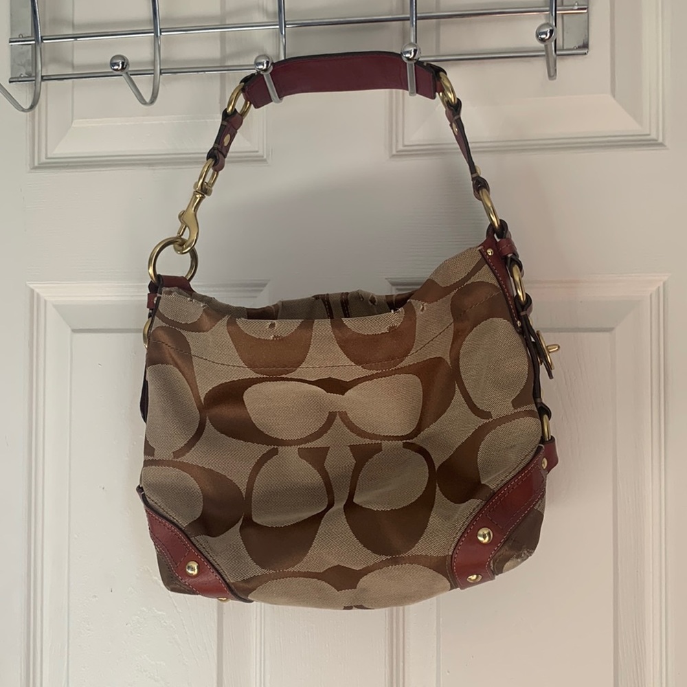 Coach Carly Hobo Bag in Signature Canvas with Hardware Accents